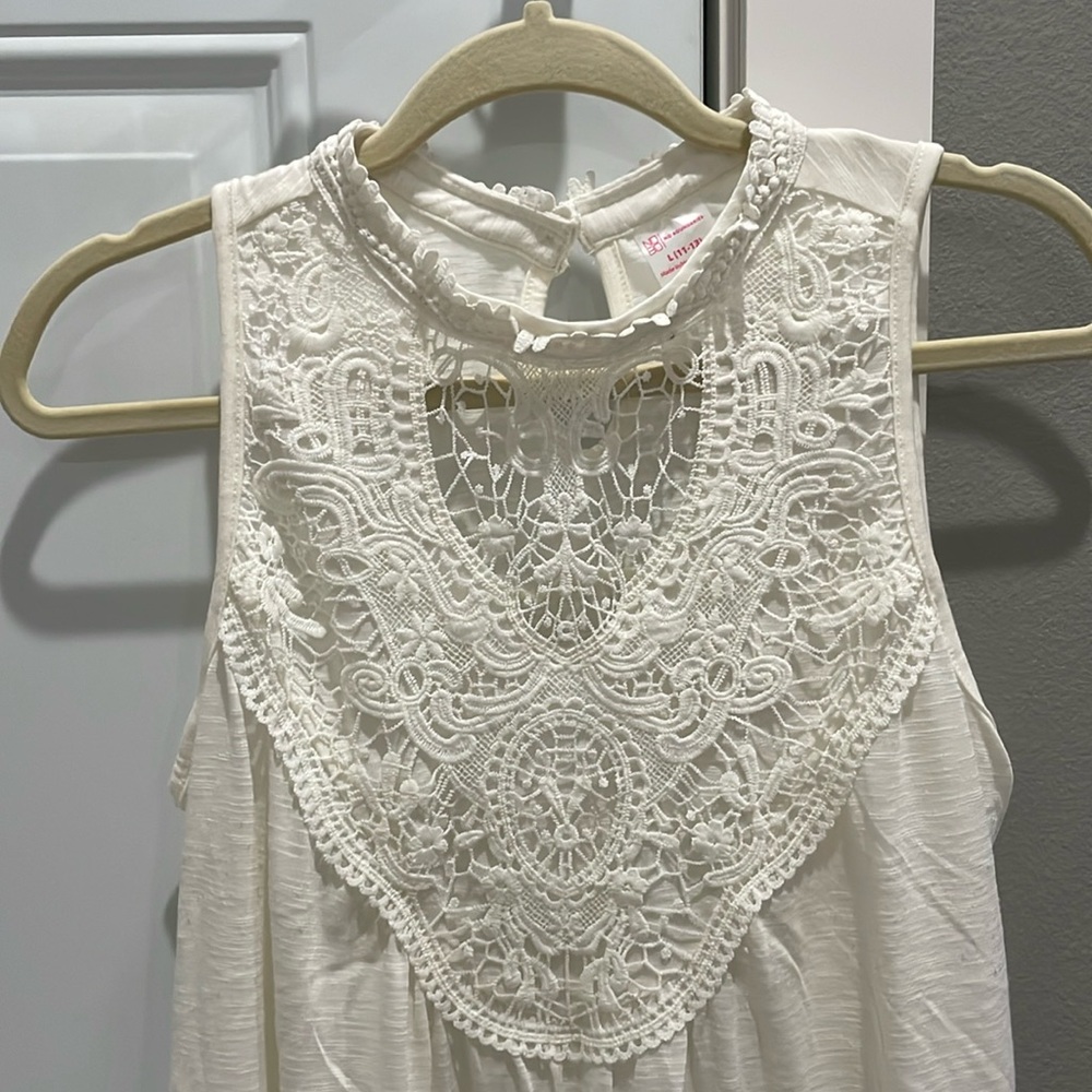 Lace embellished halter top in size L (11-13). Junior cut top.